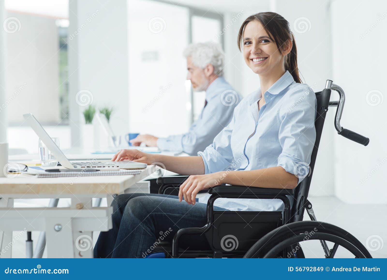smiling business woman in wheelchair