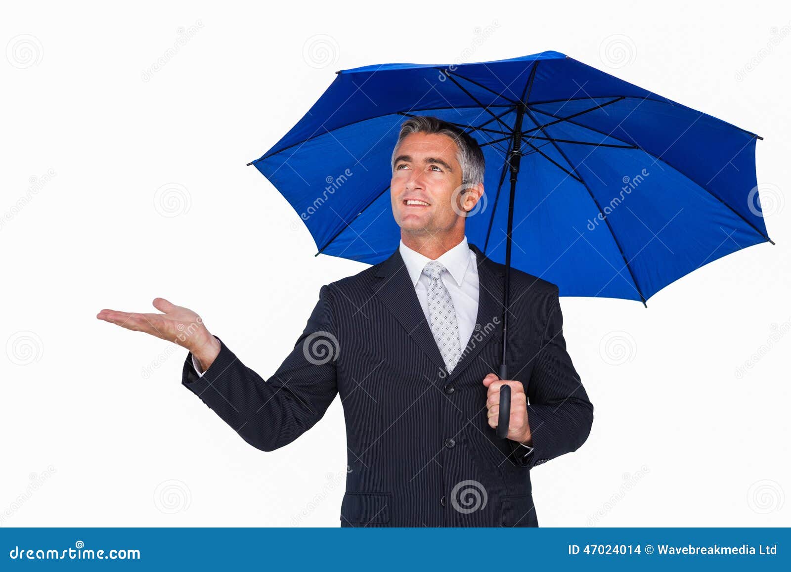 Smiling Businessman Under Umbrella with Hand Out Stock Photo Image of