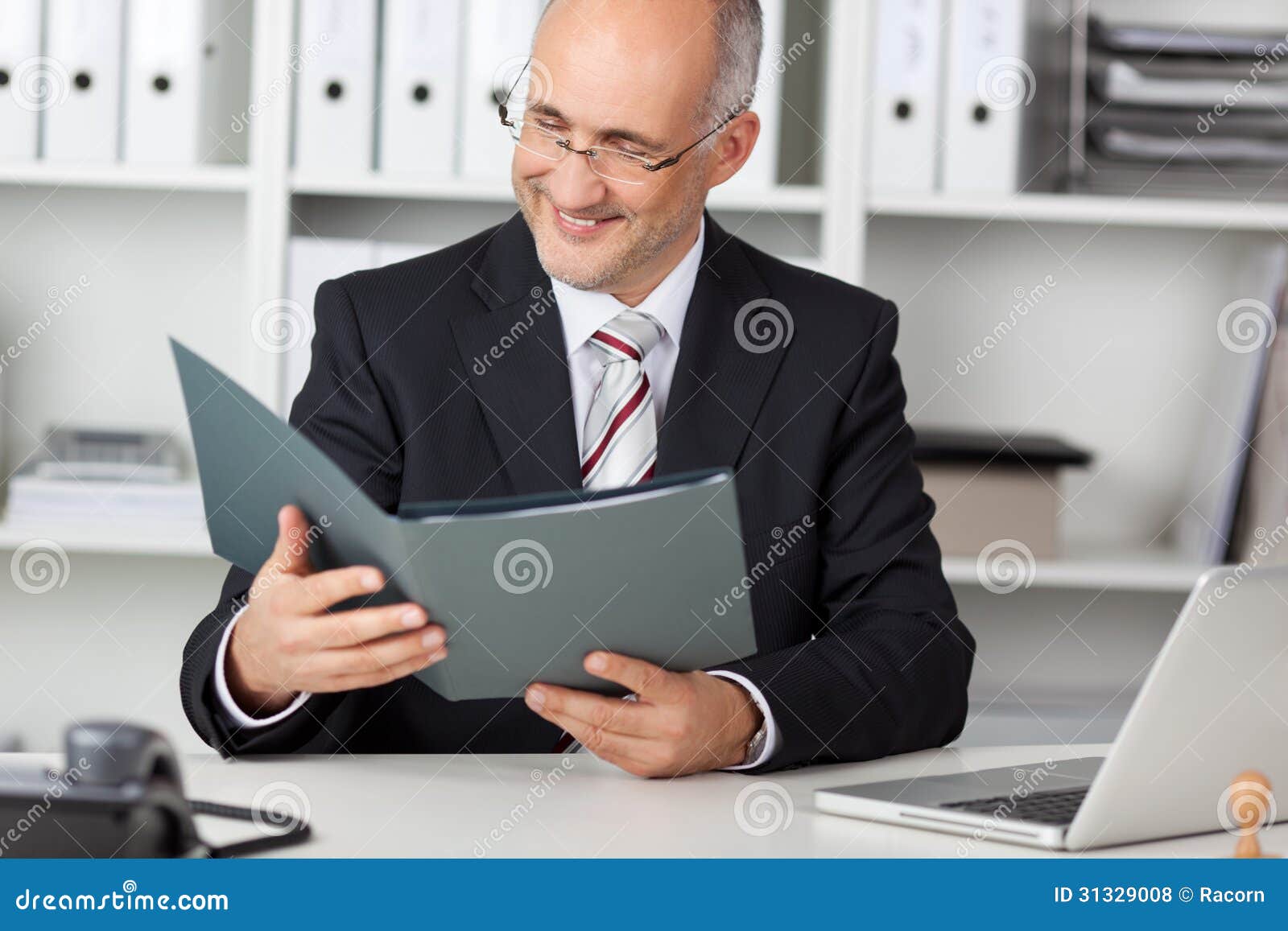 Smiling Businessmann Looking at Cv Stock Photo - Image of holding, desk ...