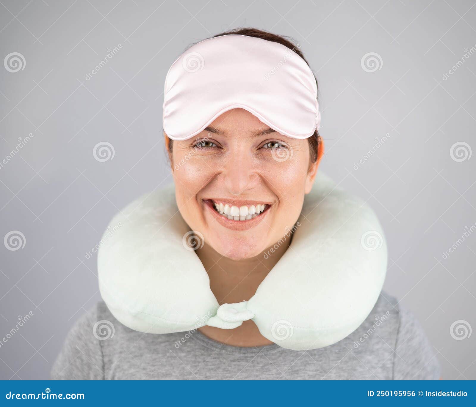 Smiling Caucasian Woman With Travel Pillow And Sleeping Mask Isolated On White Background Stock