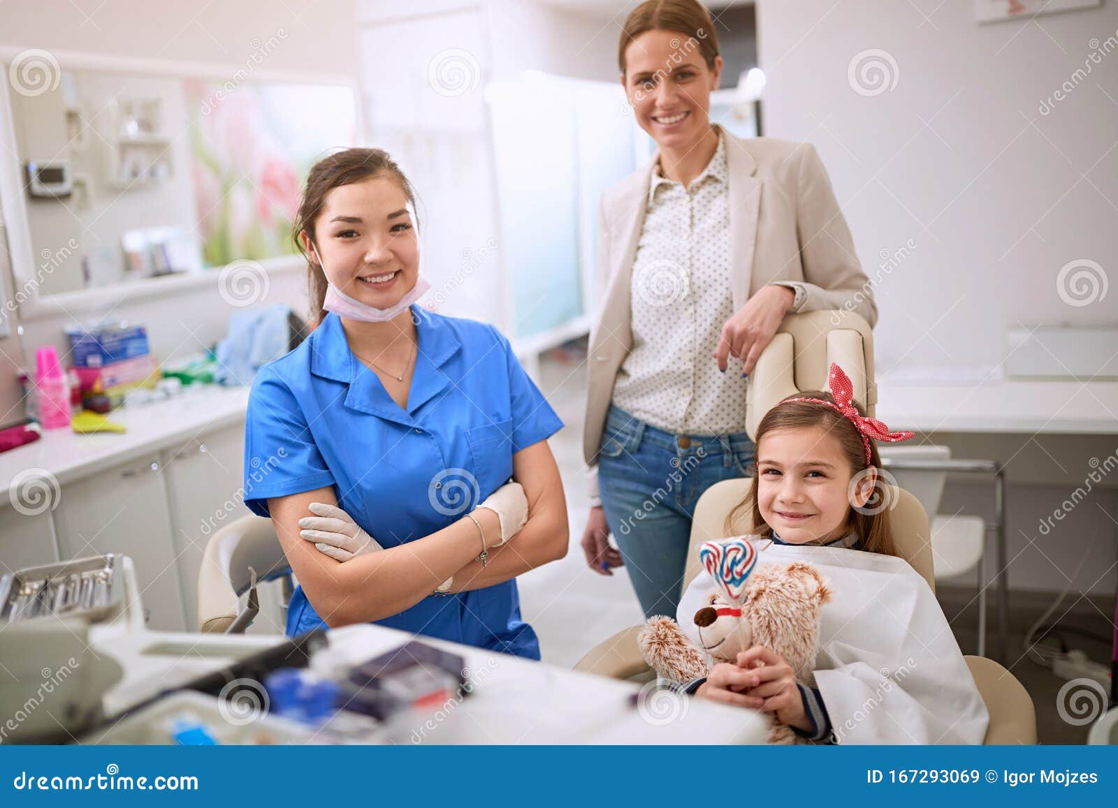 Child with mom at dentist stock image. Image of doctor 167293069