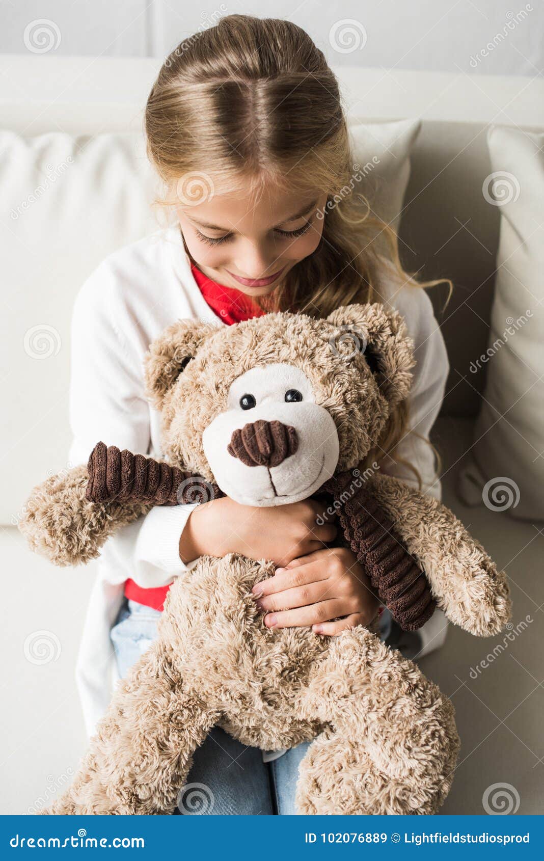 Child with teddy bear stock image. Image of indoors - 102076889