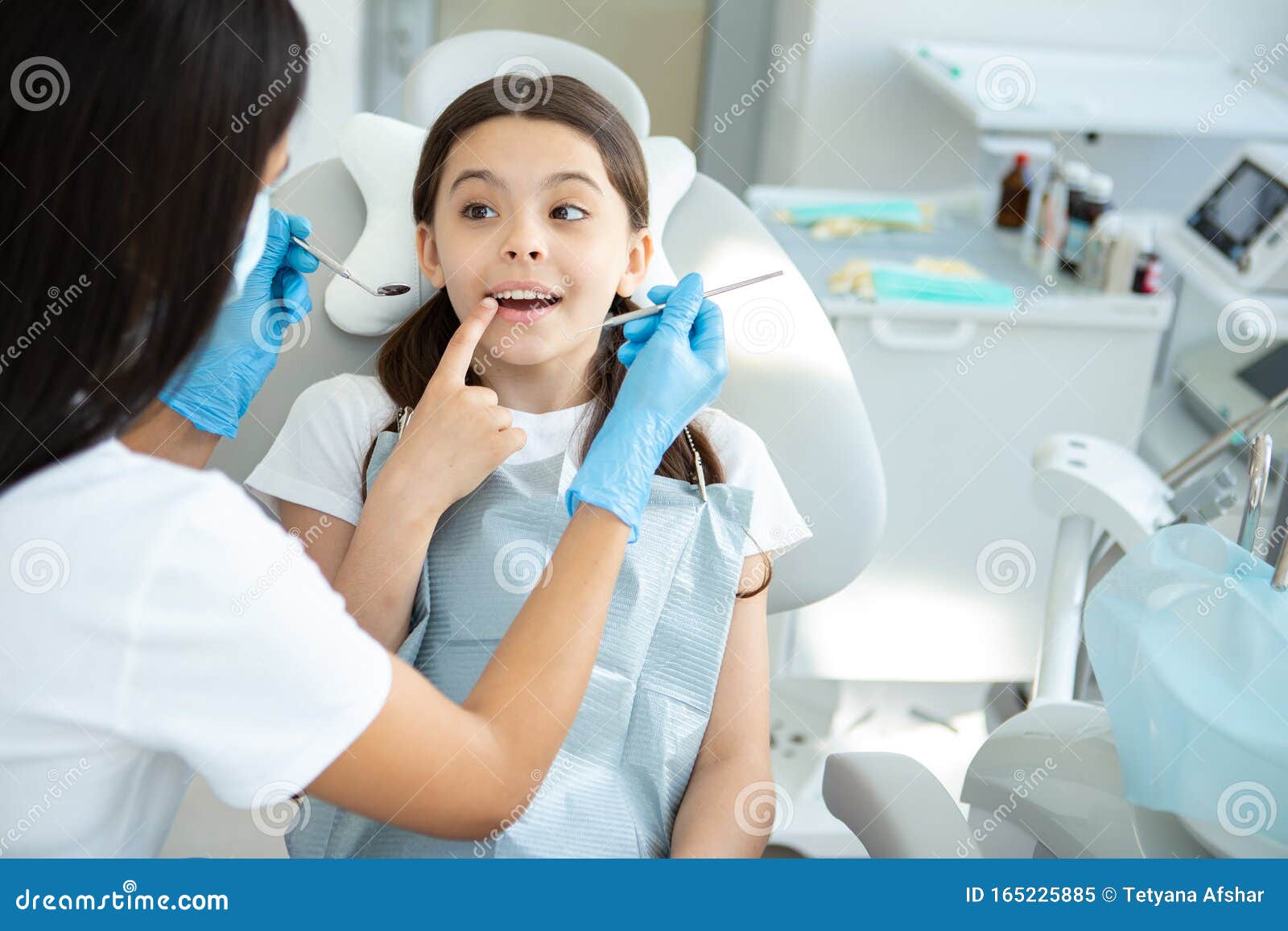 Smiling Client at Dental Procedure, Dentist Using Dental Instruments in Modern Dental Clinic