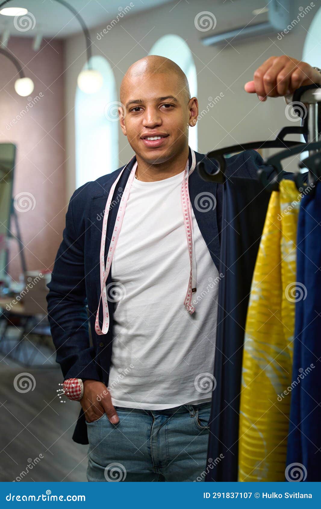 Smiling Clothier Posing for Camera in His Tailoring Workshop Stock ...