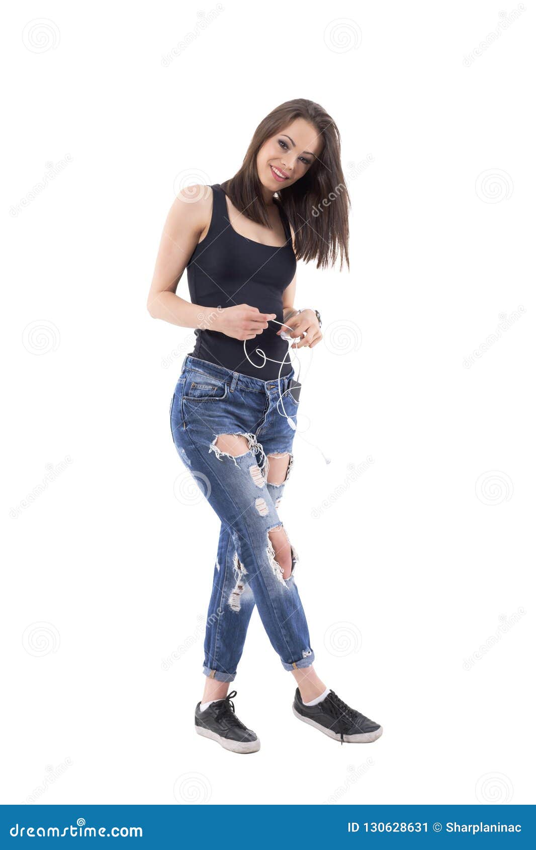 Smiling Cool Trendy Girl in Ripped Torn Jeans and Black Top Holding ...