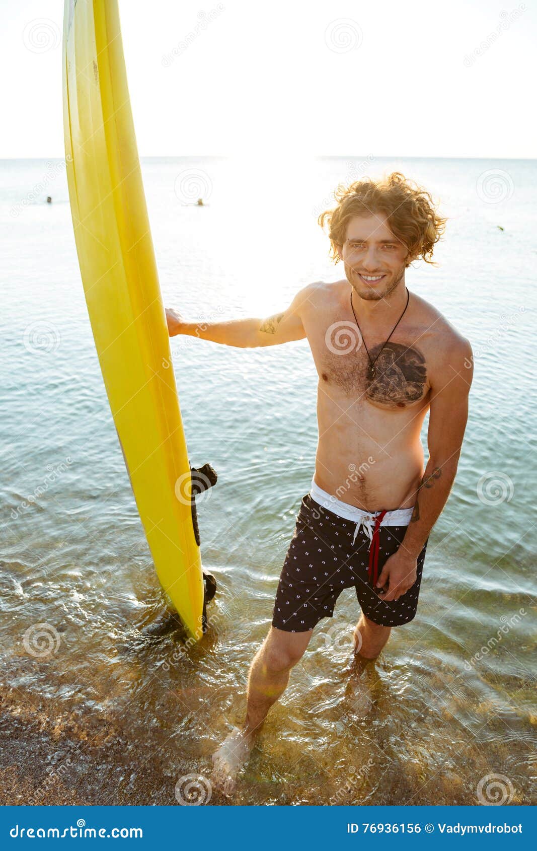 Smiling Curly Man Holding His Surf Board at the Beach Stock Photo ...