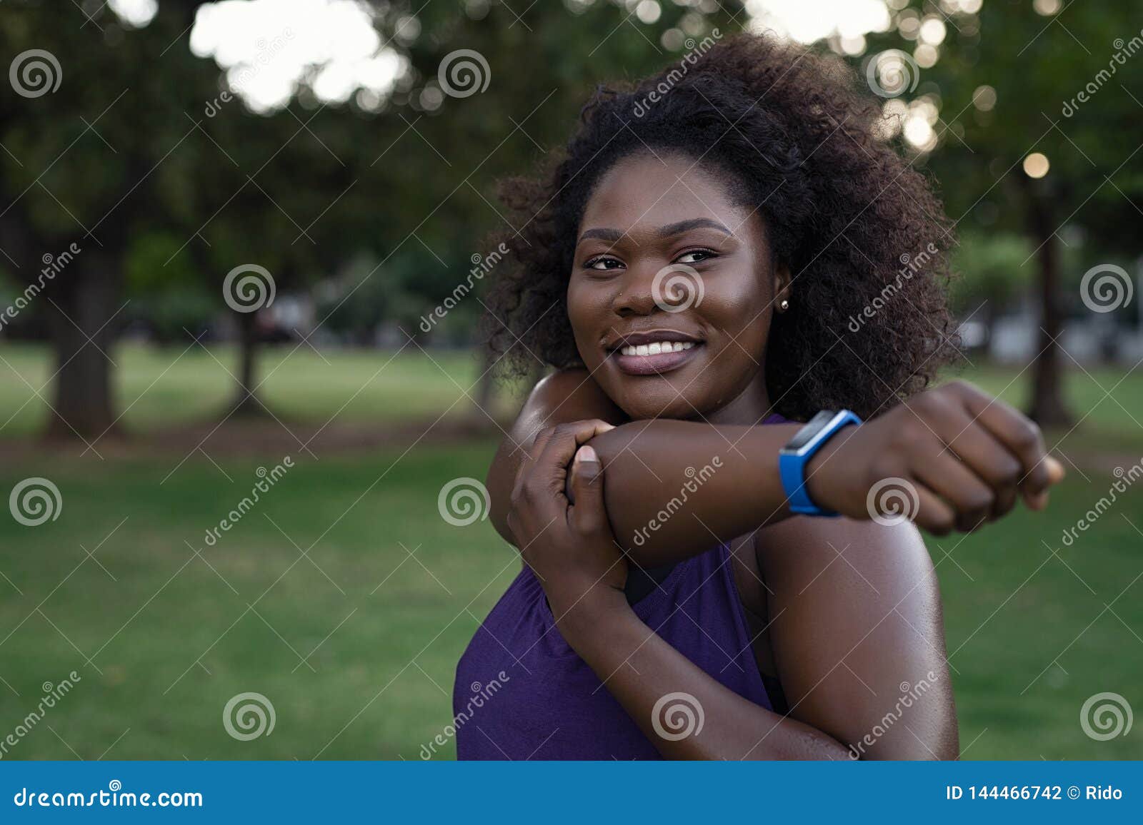 Vertical full length portrait of curvy African American woman