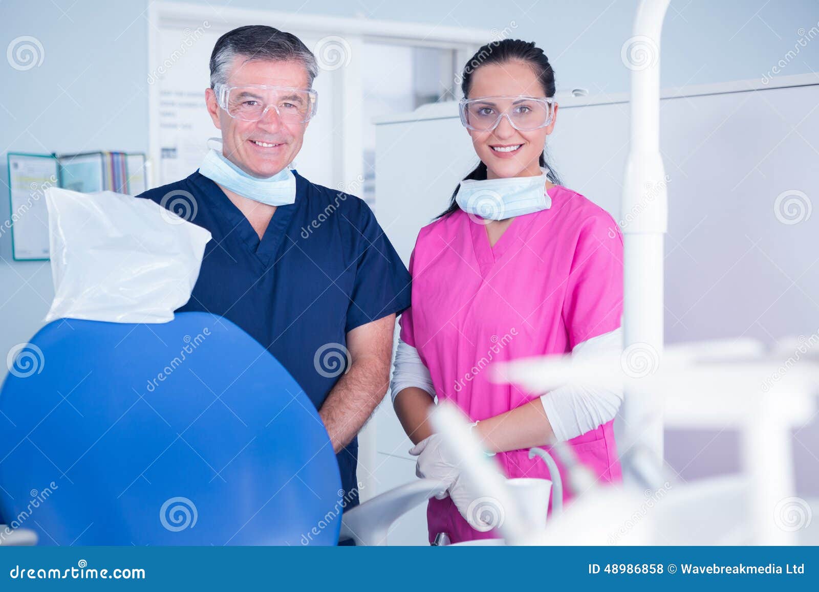 Smiling Dentist and Assistant with Protective Glasses Stock Photo Image of dentist, woman