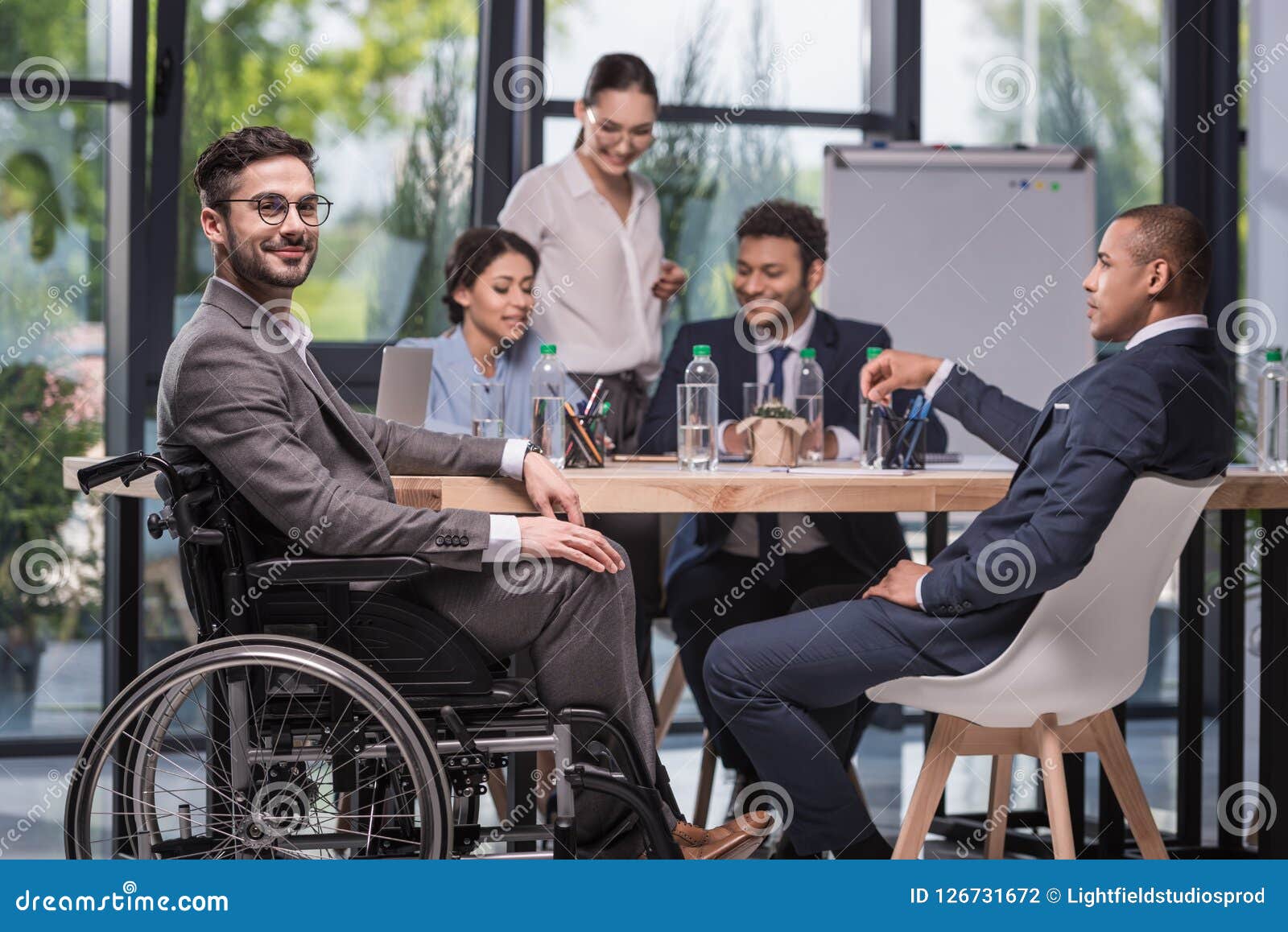 selective focus of smiling disabled businessman