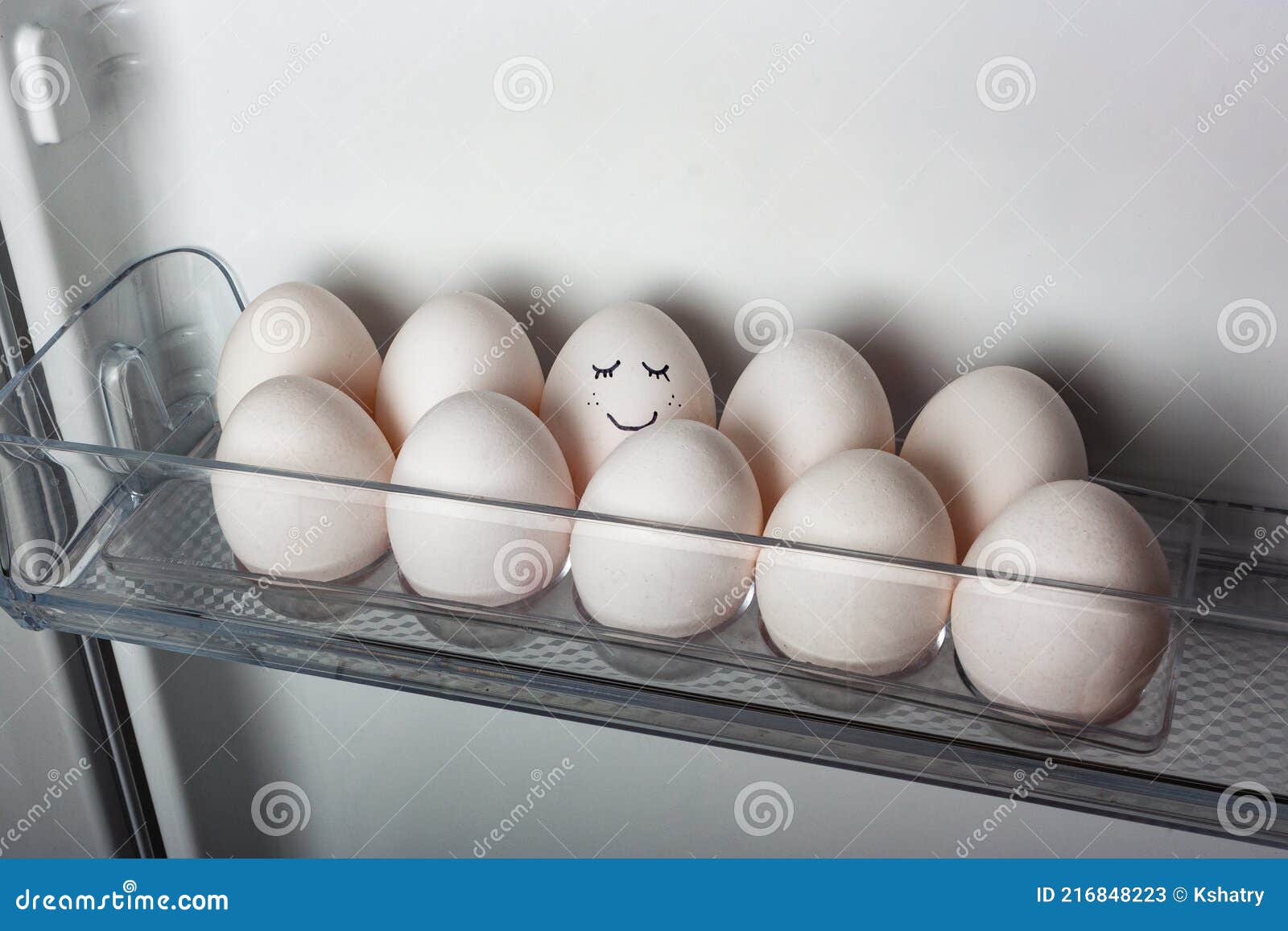 Smiling Egg in a Row of White Eggs in Fridge Stock Image Image of