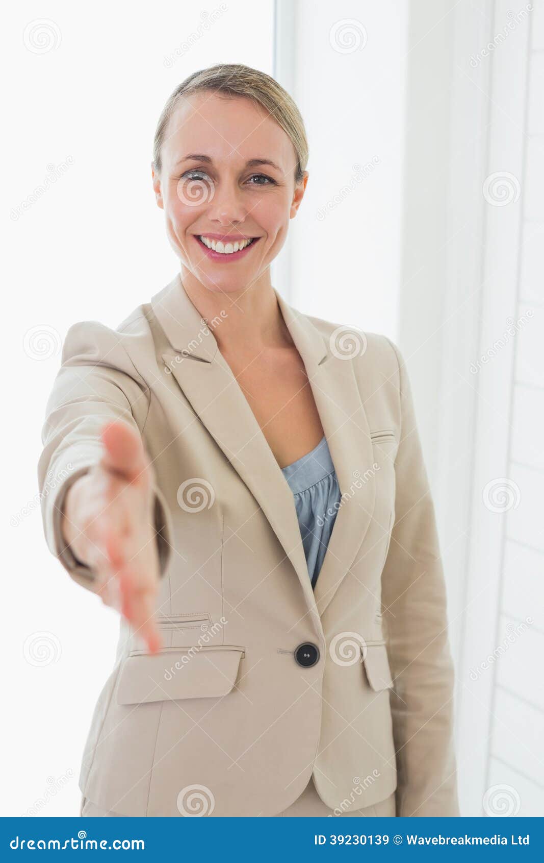 Smiling Estate Agent Holding Her Hand Out To Camera Stock Image Image 