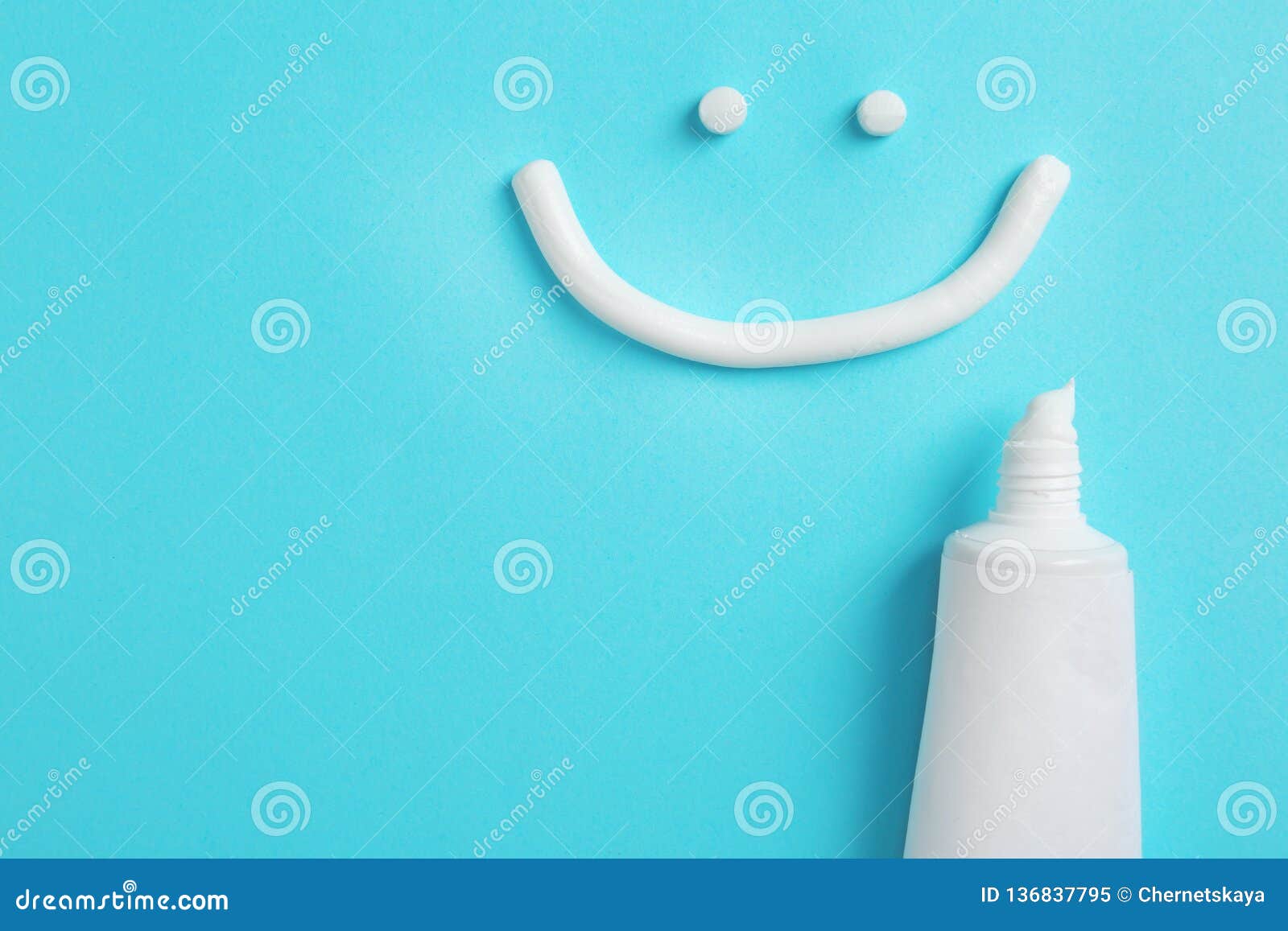 Smiling Face Made of Toothpaste, Tube on Color Background, Top View
