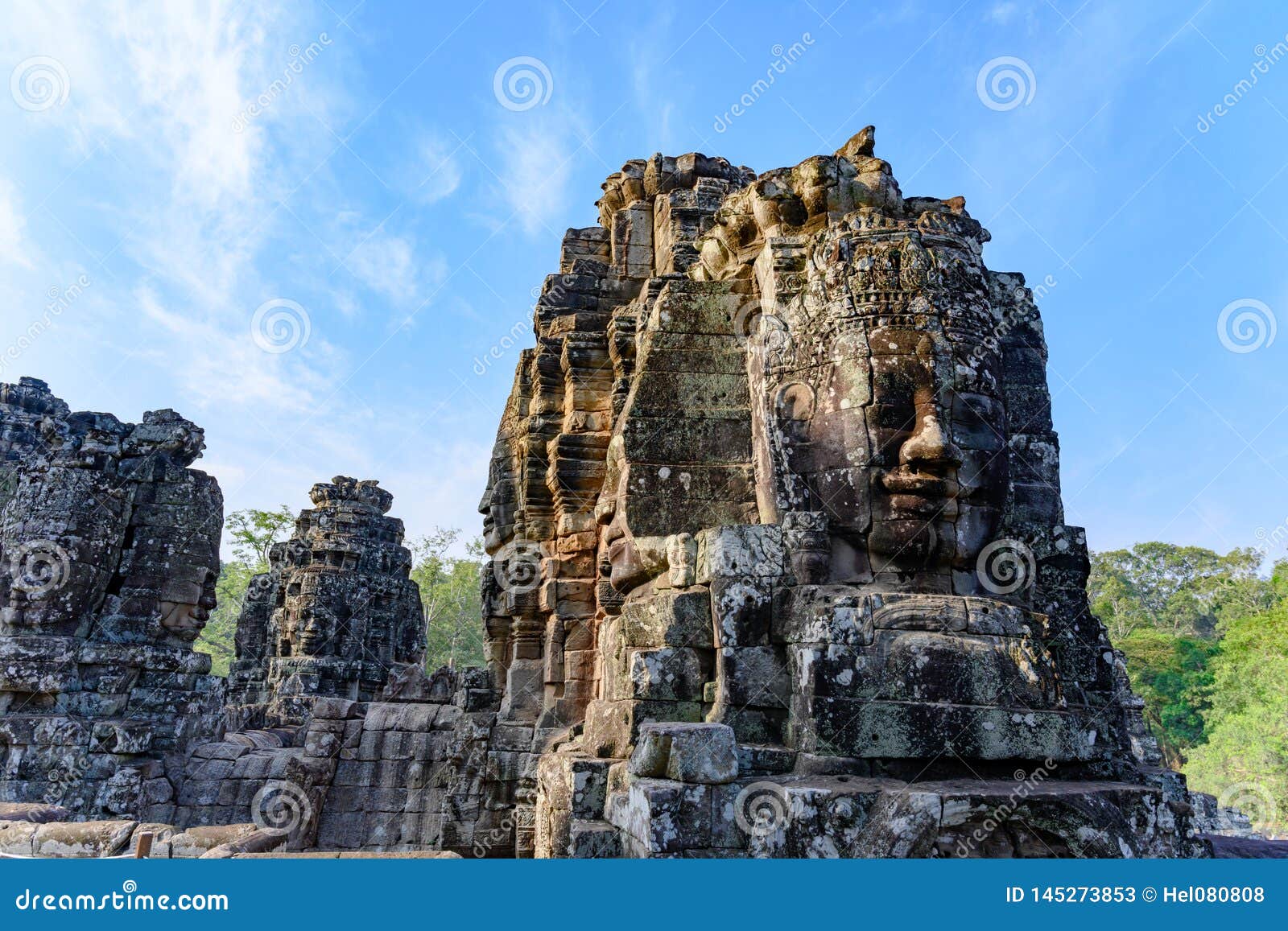 smiling faces fallen apart on temple of angkor thom, cambodia.