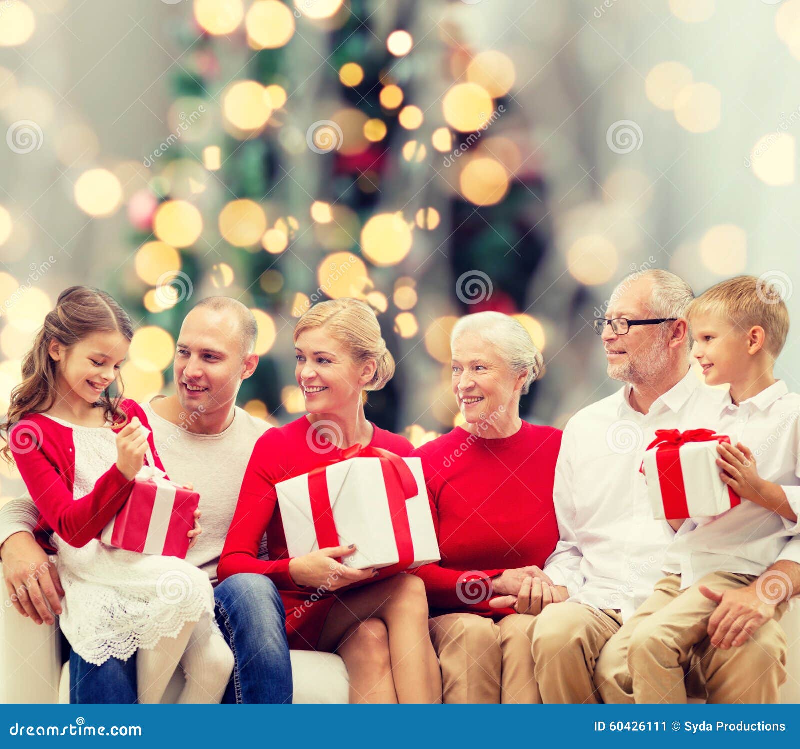 Smiling family with gifts stock image. Image of december - 60426111