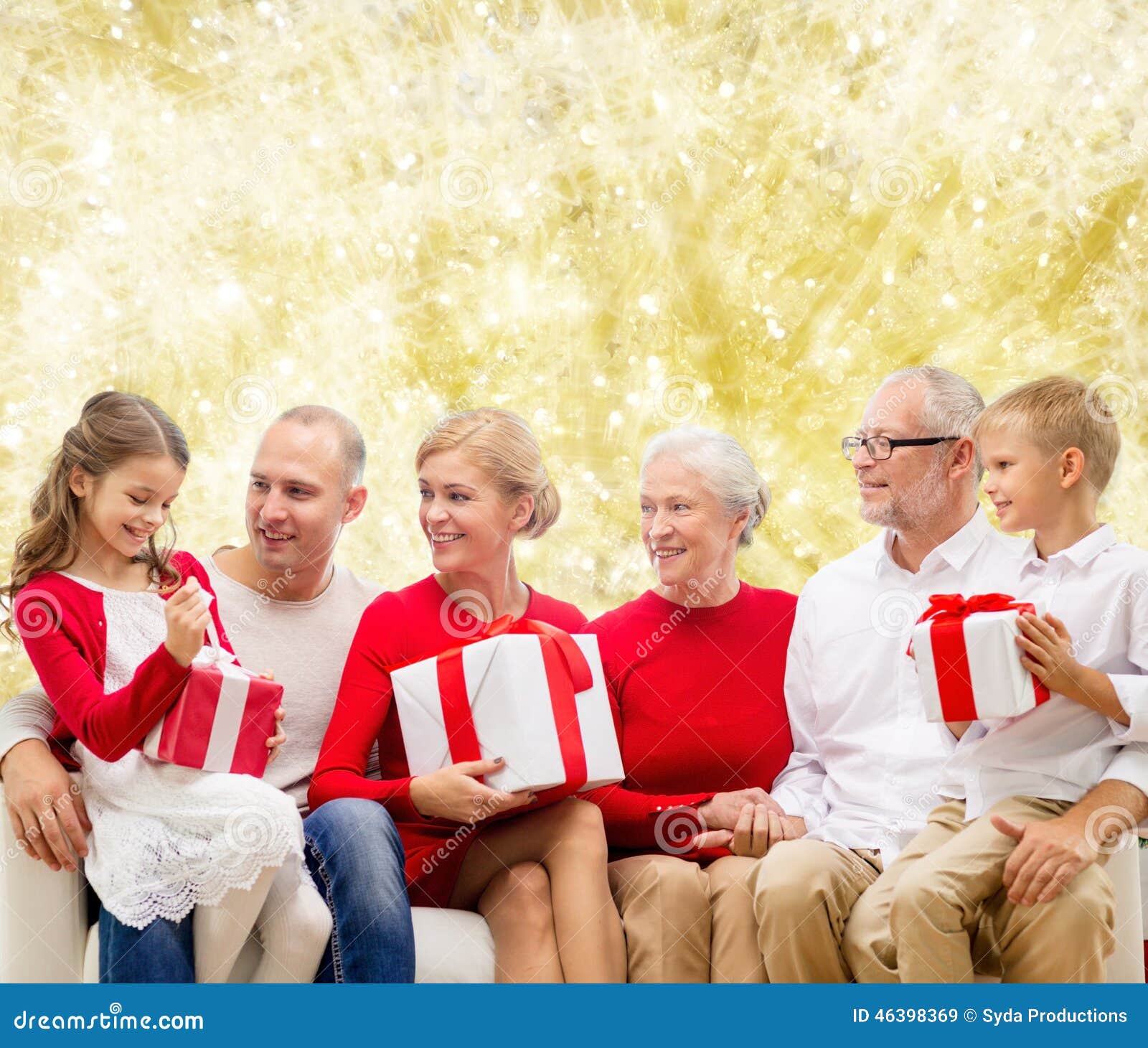 Smiling family with gifts stock image. Image of golden - 46398369