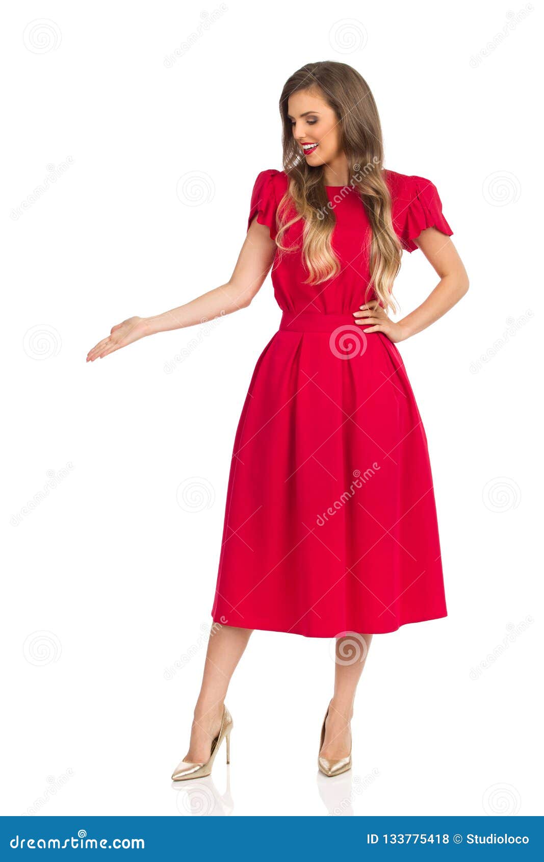 Smiling Fashion Woman in Red Dress and Gold High Heels is Looking Away ...