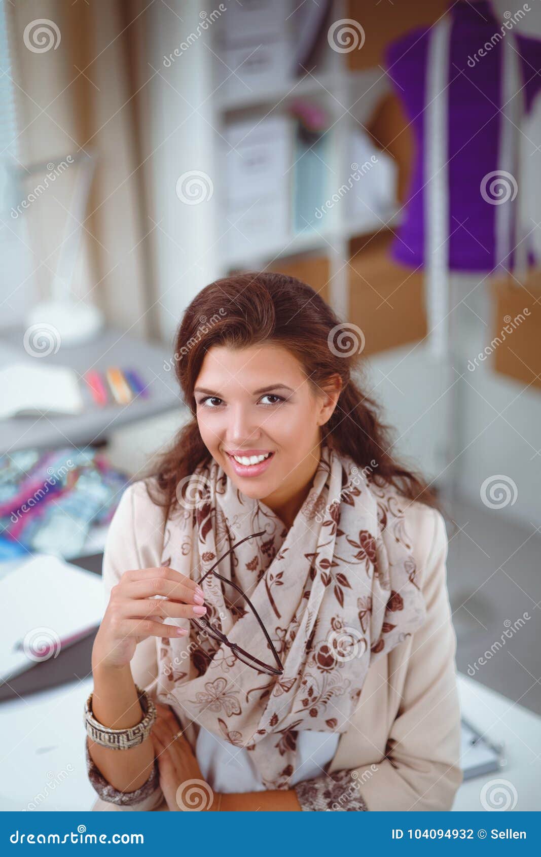 Smiling Female Fashion Designer Sitting at Office Desk Stock Photo ...