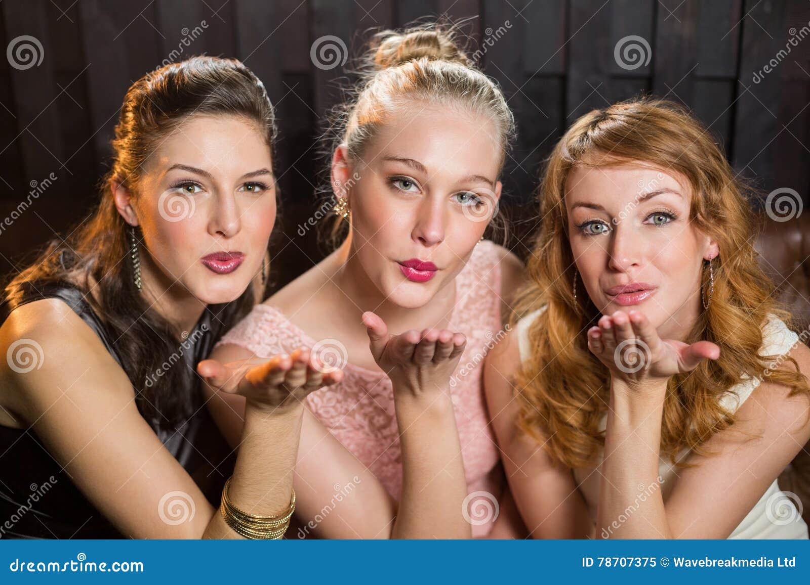 Smiling Female Friends Blowing A Kiss Towards Camera Stock Image Image Of Elegant Luxury