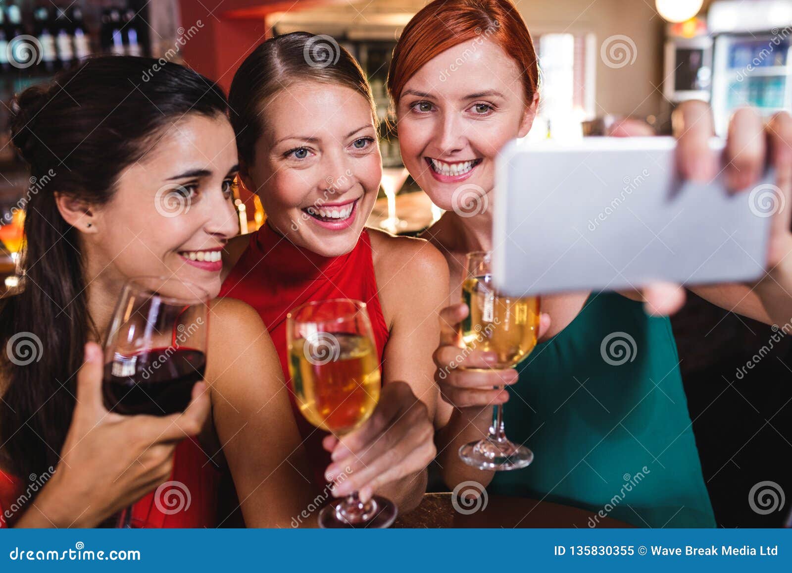 Female Friends Taking Selfie with Wine Glass in Night Club Stock Image ...