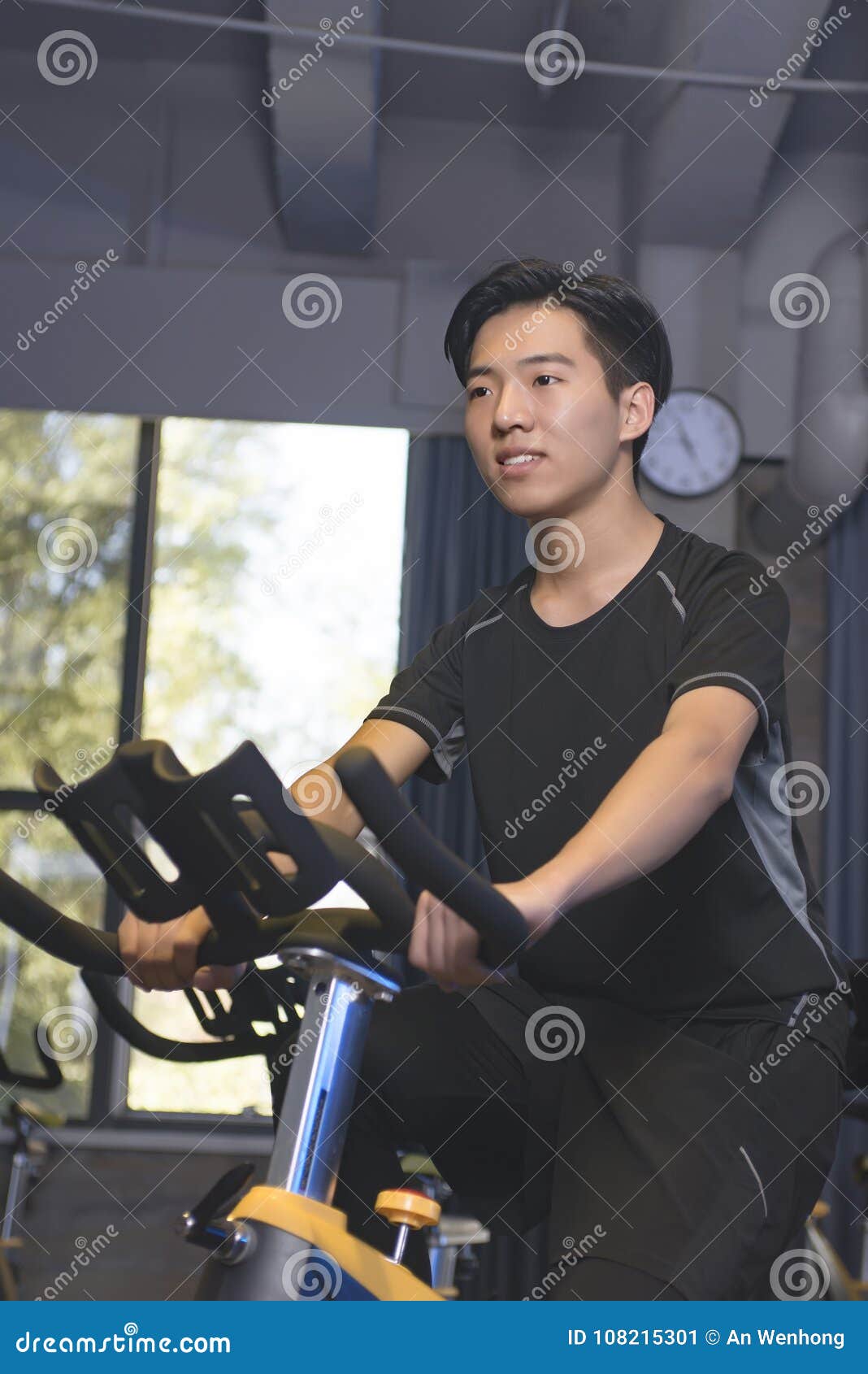 Asian Men in the Gym To Ride a Bicycle. Stock Image Image of happy
