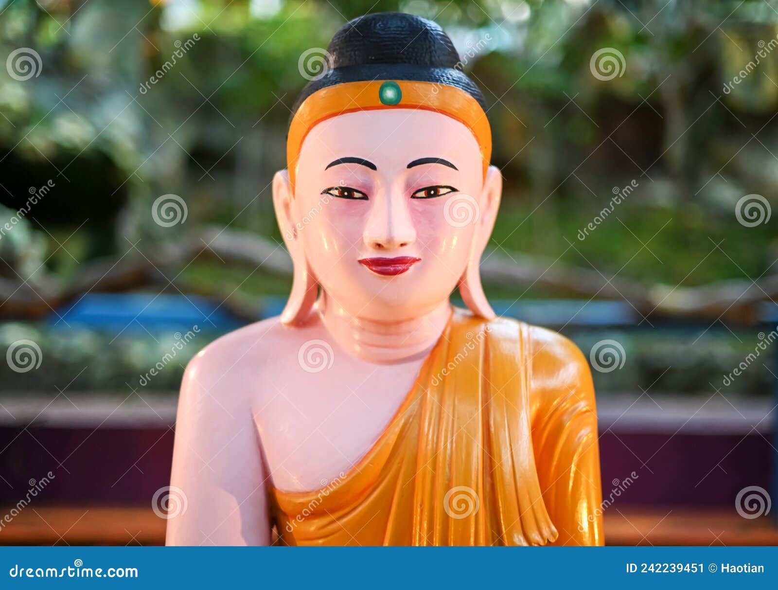 smiling gautama buddha at haw par villa, singapore