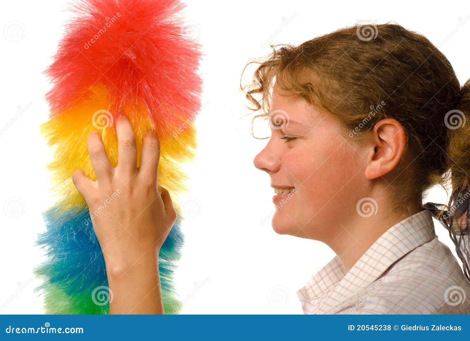 Smiling girl with duster stock photo. Image of isolated 20545238