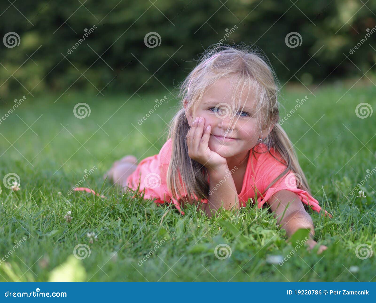 Smiling girl on grass stock photo. Image of barefoot - 19220786