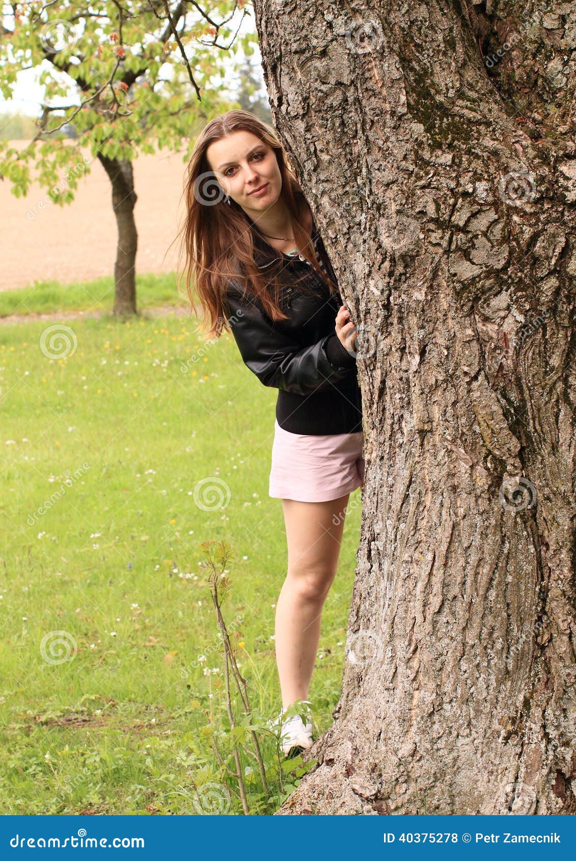 Girl Hiding Behind Tree 