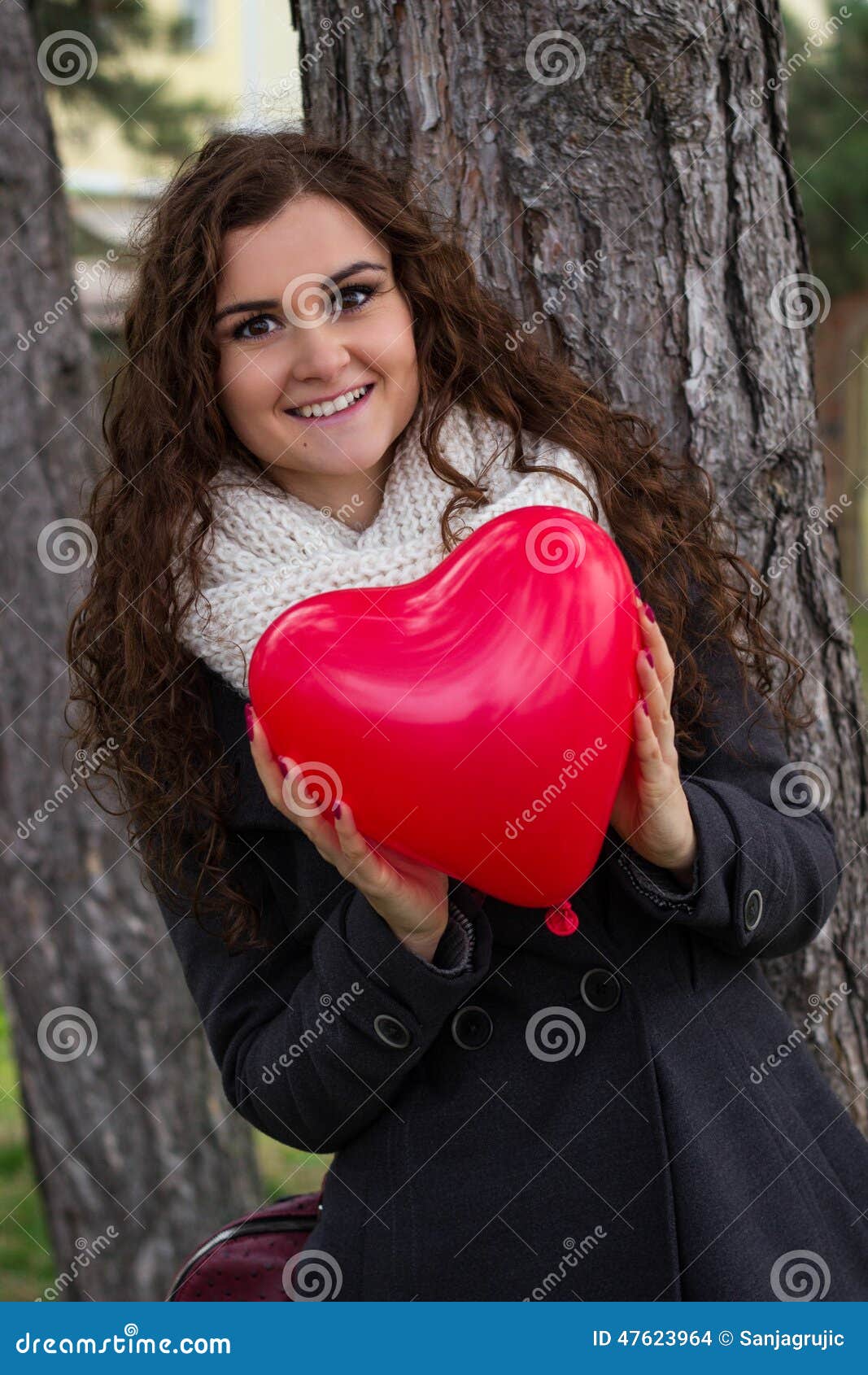 Smiling Girl Holding a Heart Stock Photo - Image of heart, girl: 47623964