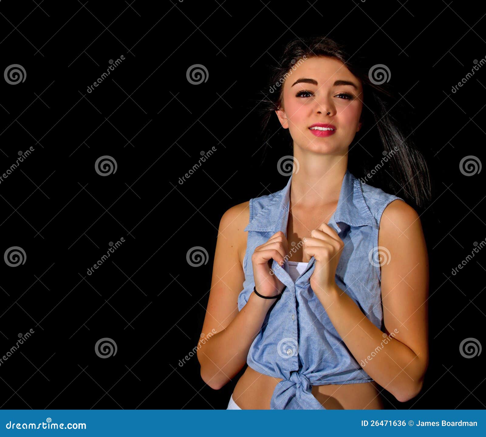Smiling Girl Pulling At Her Shirt Coloar Stock Photo Image 26471636