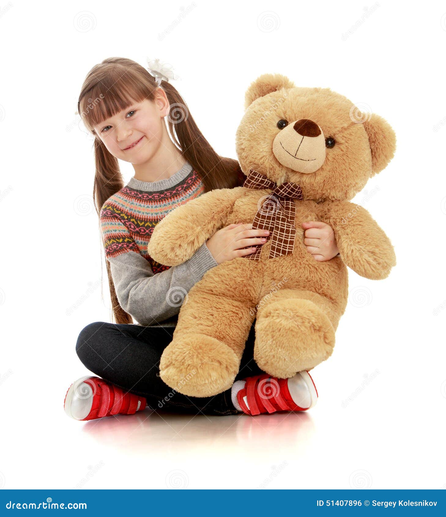 Smiling Girl Sitting on the Floor and Hugging Stock Photo - Image of ...