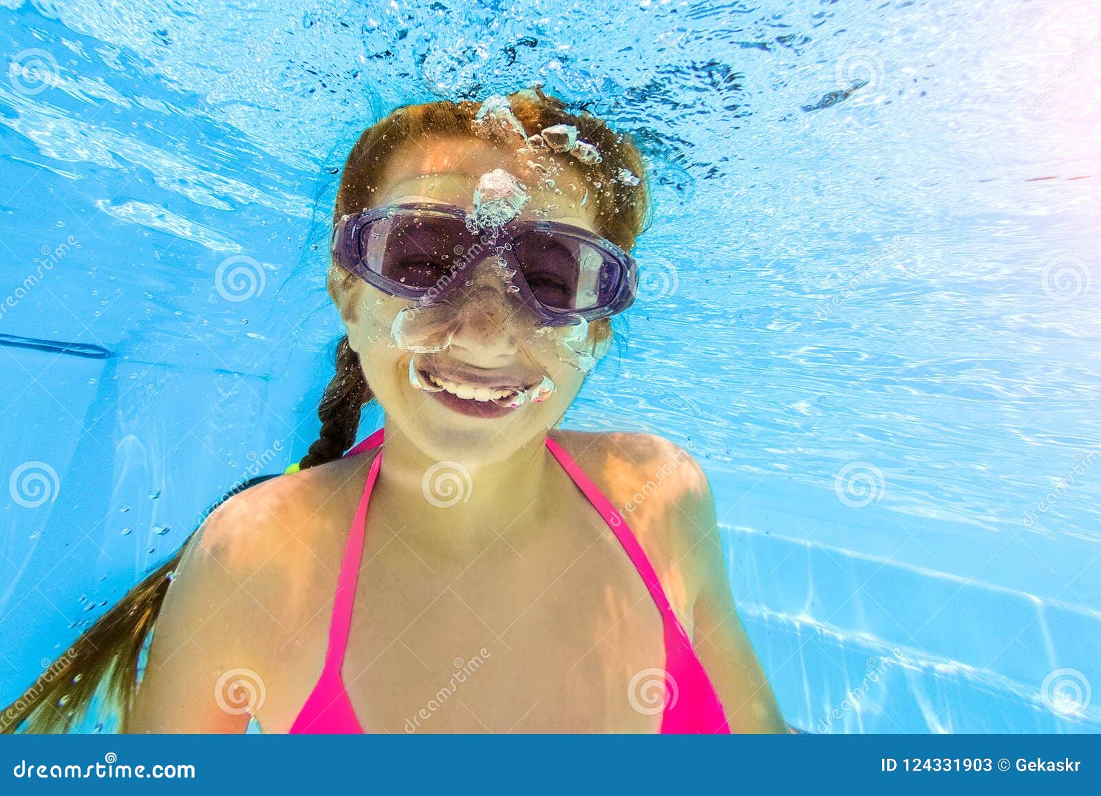 Smiling Girl Swimming Underwater in Pool Stock Image - Image of ...