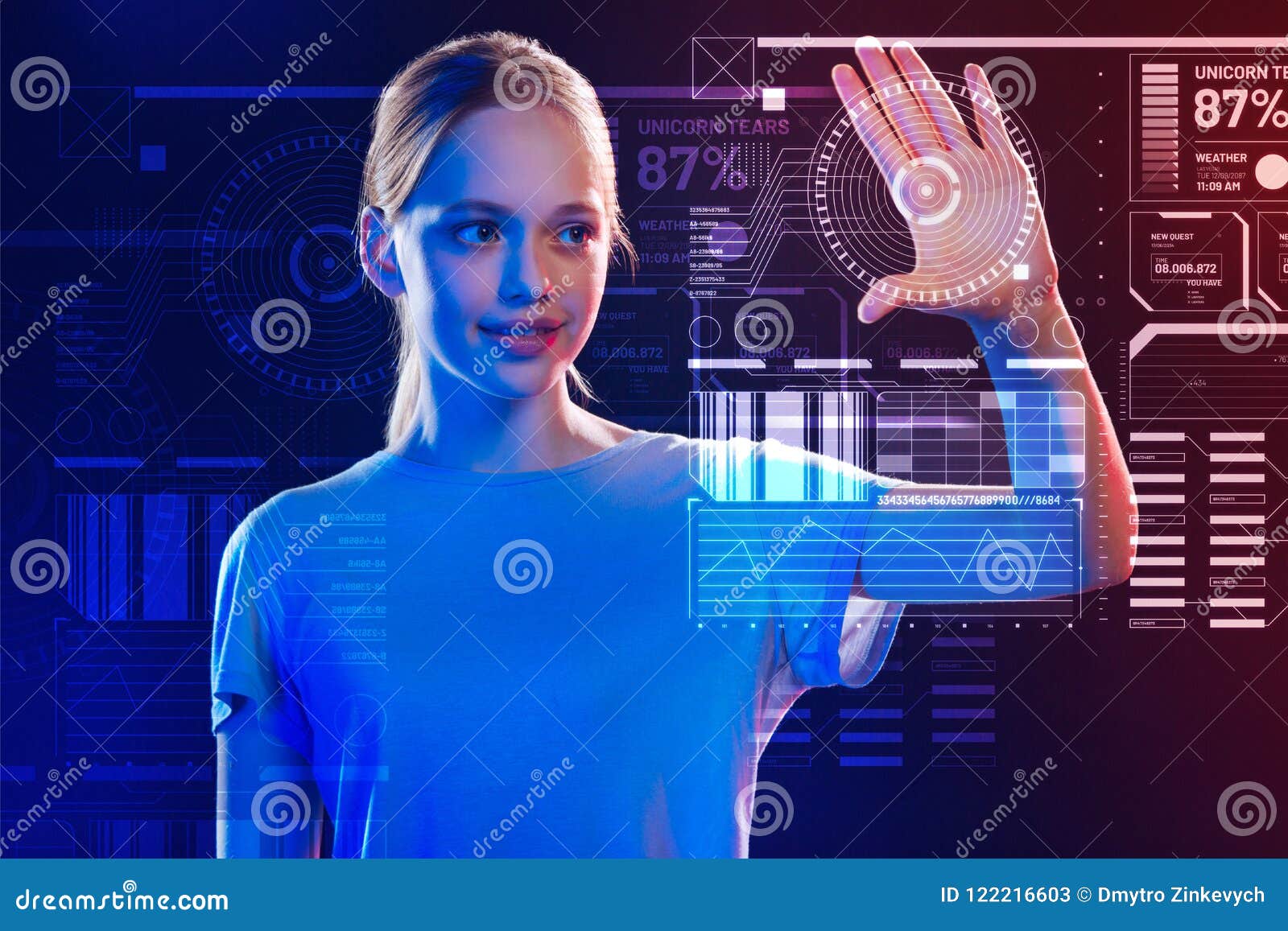 Smiling girl touching the screen while using a new security system. Convenient system. Cheerful calm teenage girl carefully touching a transparent screen and scanning her hand while using a futuristic security system