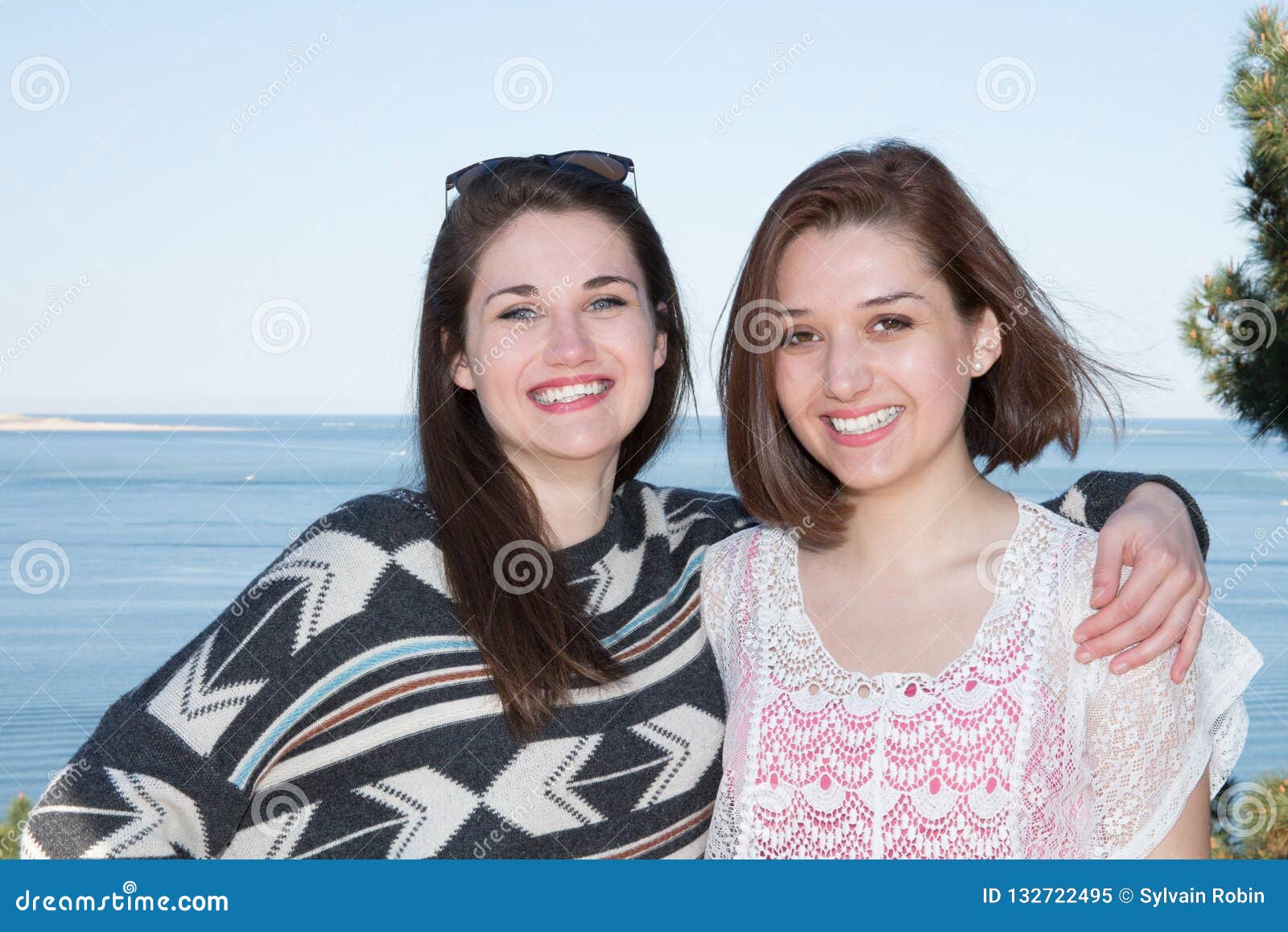 Lesbian Couple Holding Hugging Each Other On The Beach Coast Stock
