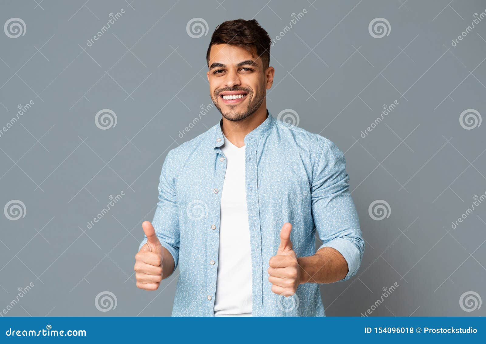 Smiling Guy Showing Thumbs Up with Both Hands Stock Photo - Image of ...