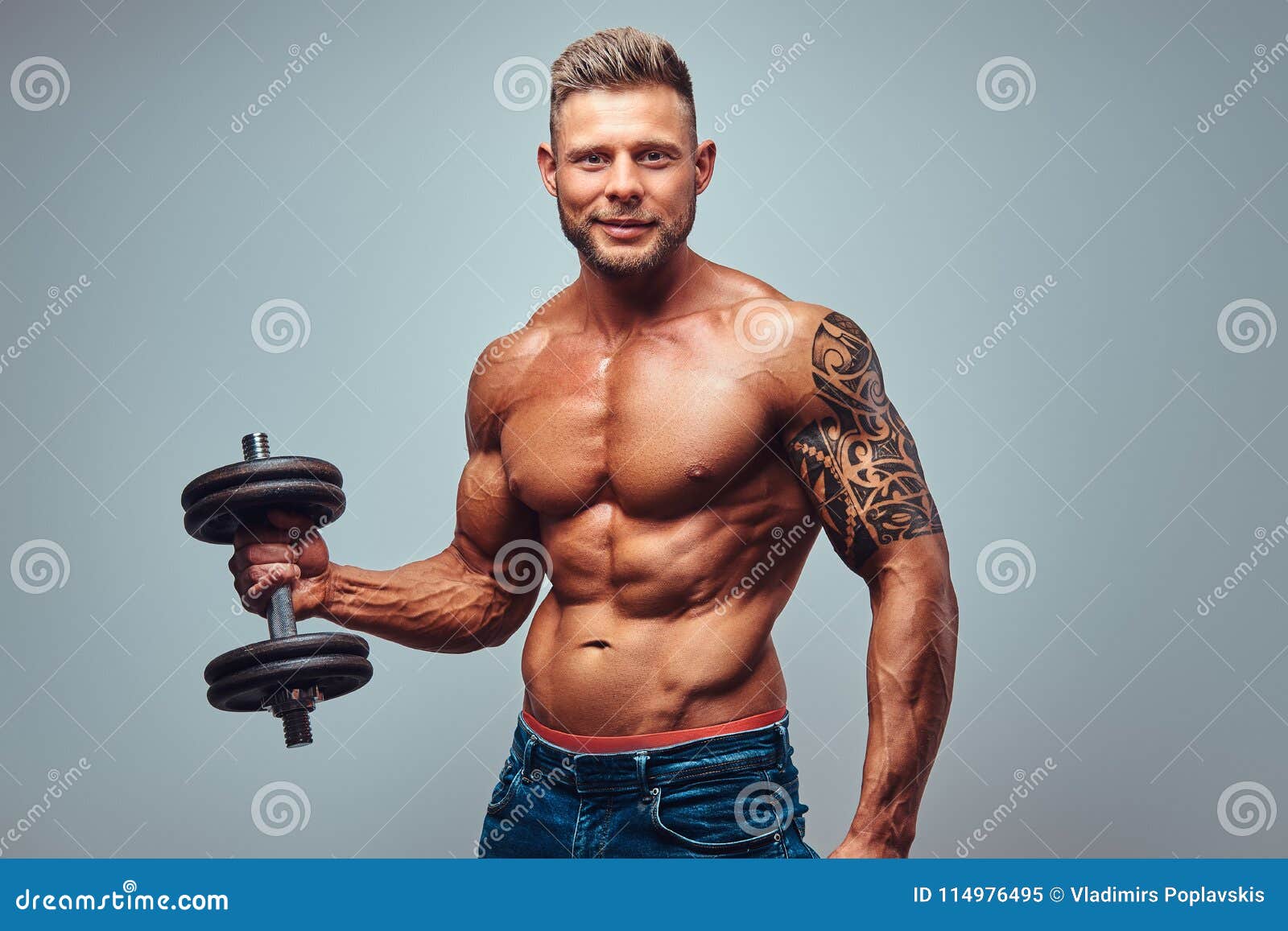 A Handsome Shirtless Tattooed Bodybuilder with Stylish Haircut and Beard,  Wearing Sports Shorts, Posing in a Studio Stock Image - Image of champion,  caucasian: 114976495