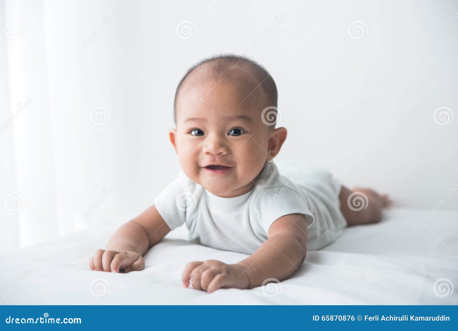 smiling happy baby tummy time