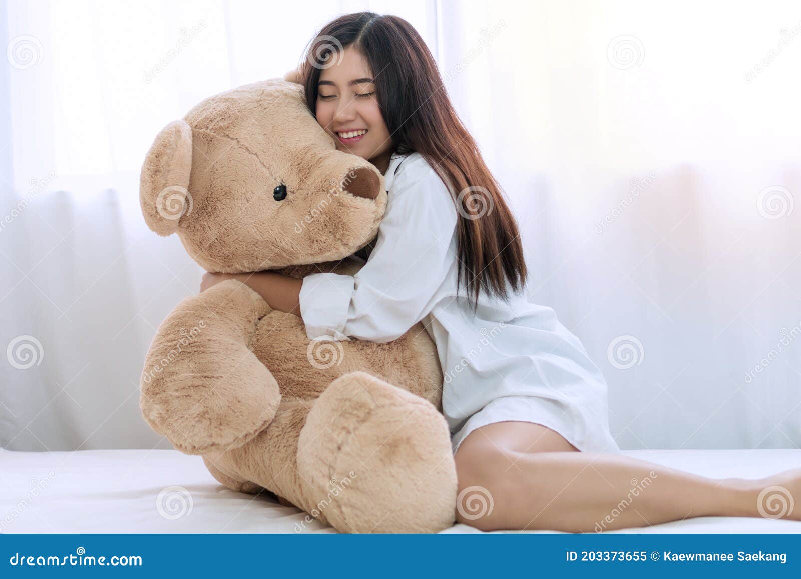 Girl Hugging Teddy Bear