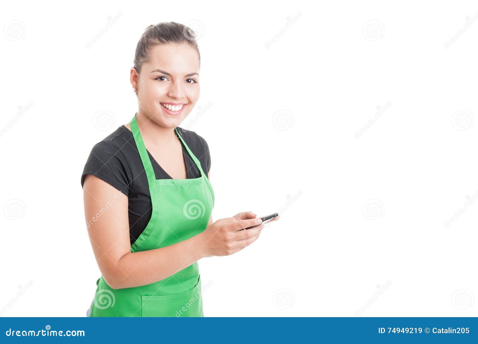 Smiling hypermarket employee reading something funny on mobile phone isolated on white background with text area