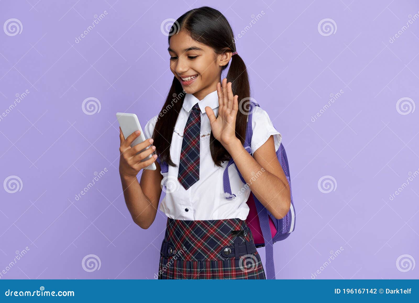 Smiling Indian School Girl Video Calling on Mobile Phone Isolated on  Background. Stock Photo - Image of learn, cellphone: 196167142