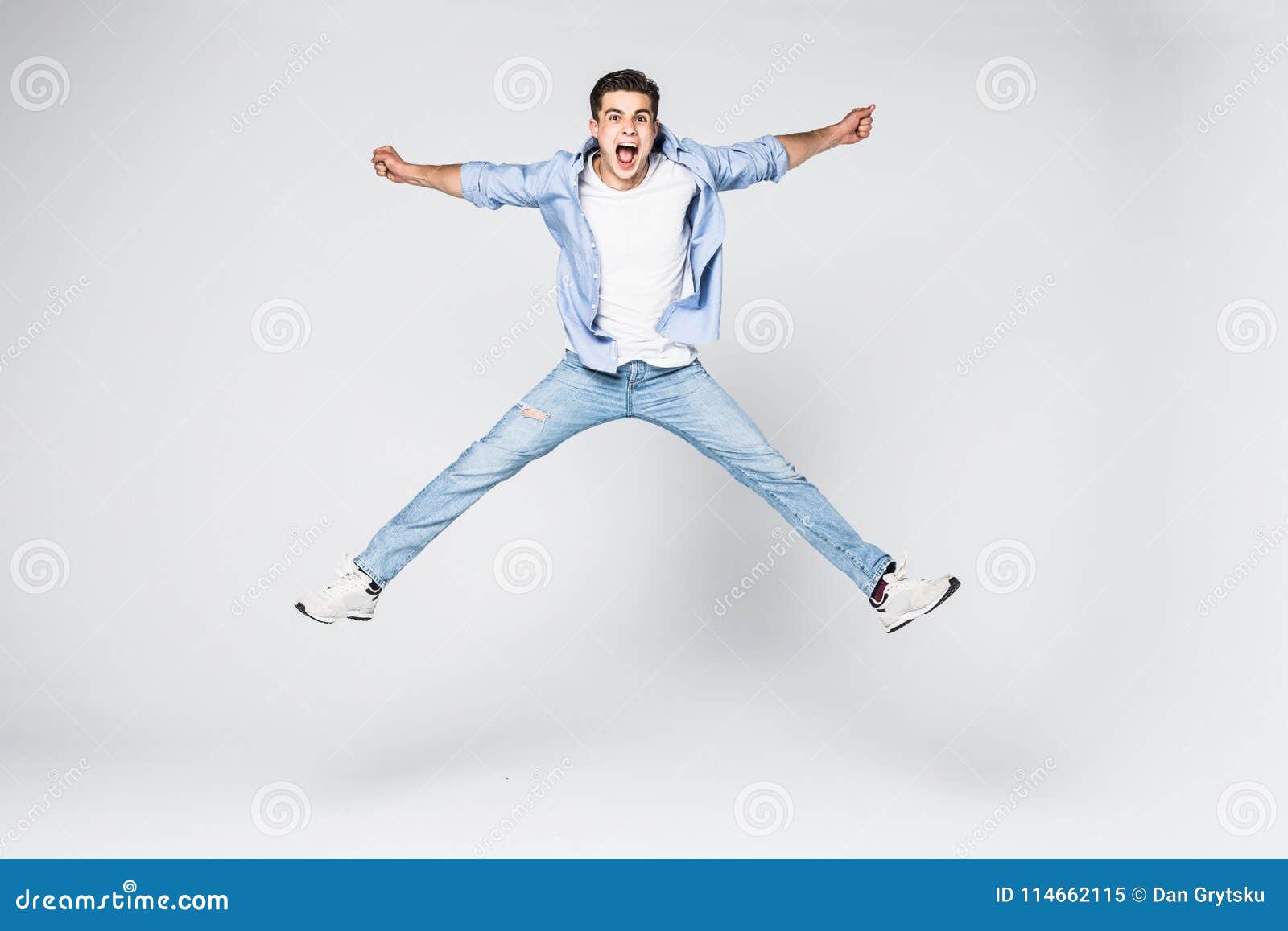 Smiling Joyful Man Jumping on White Background. Stock Image - Image of ...