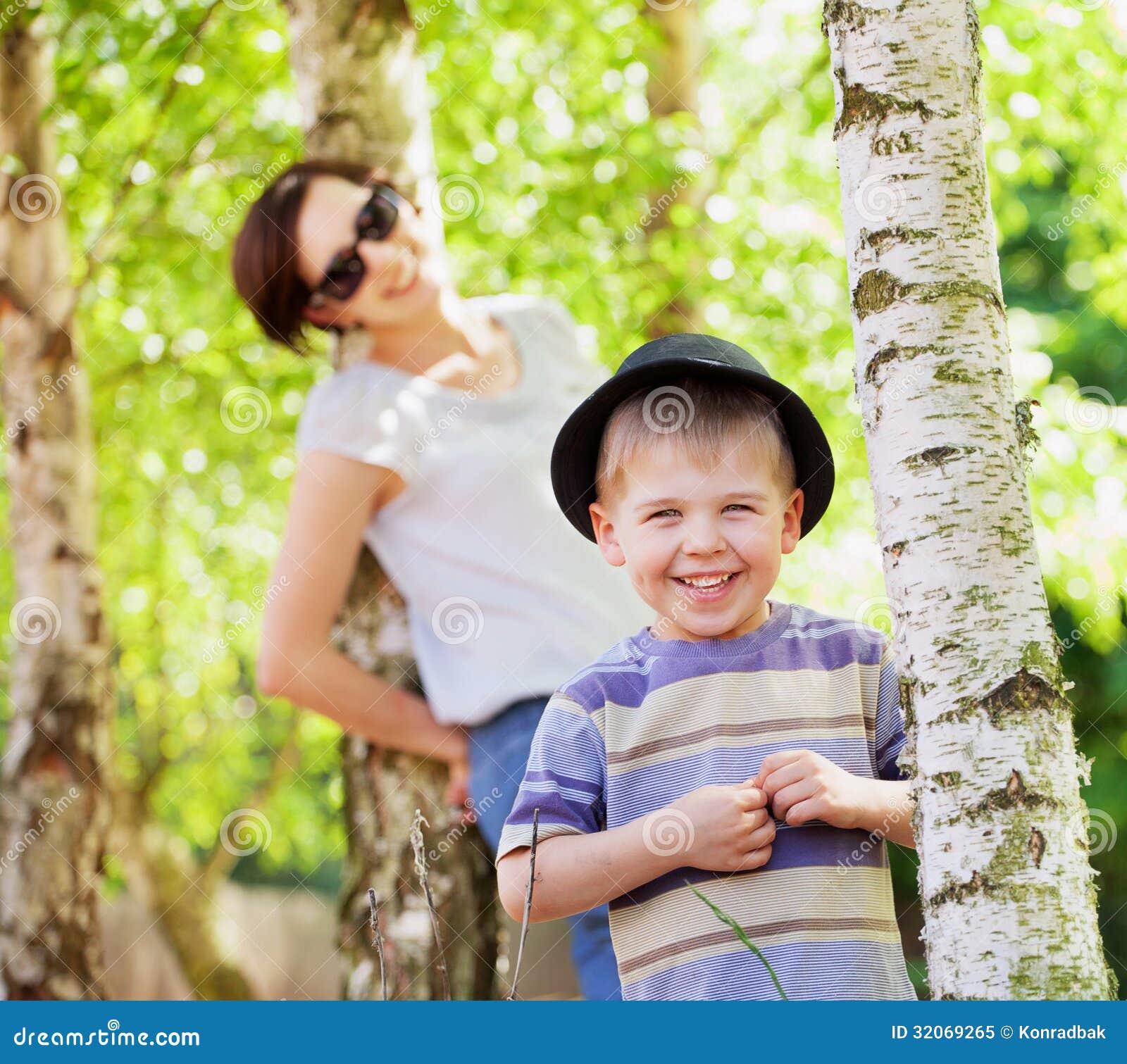Smiling Kid And His Mom In The Background RoyaltyFree Stock Photo