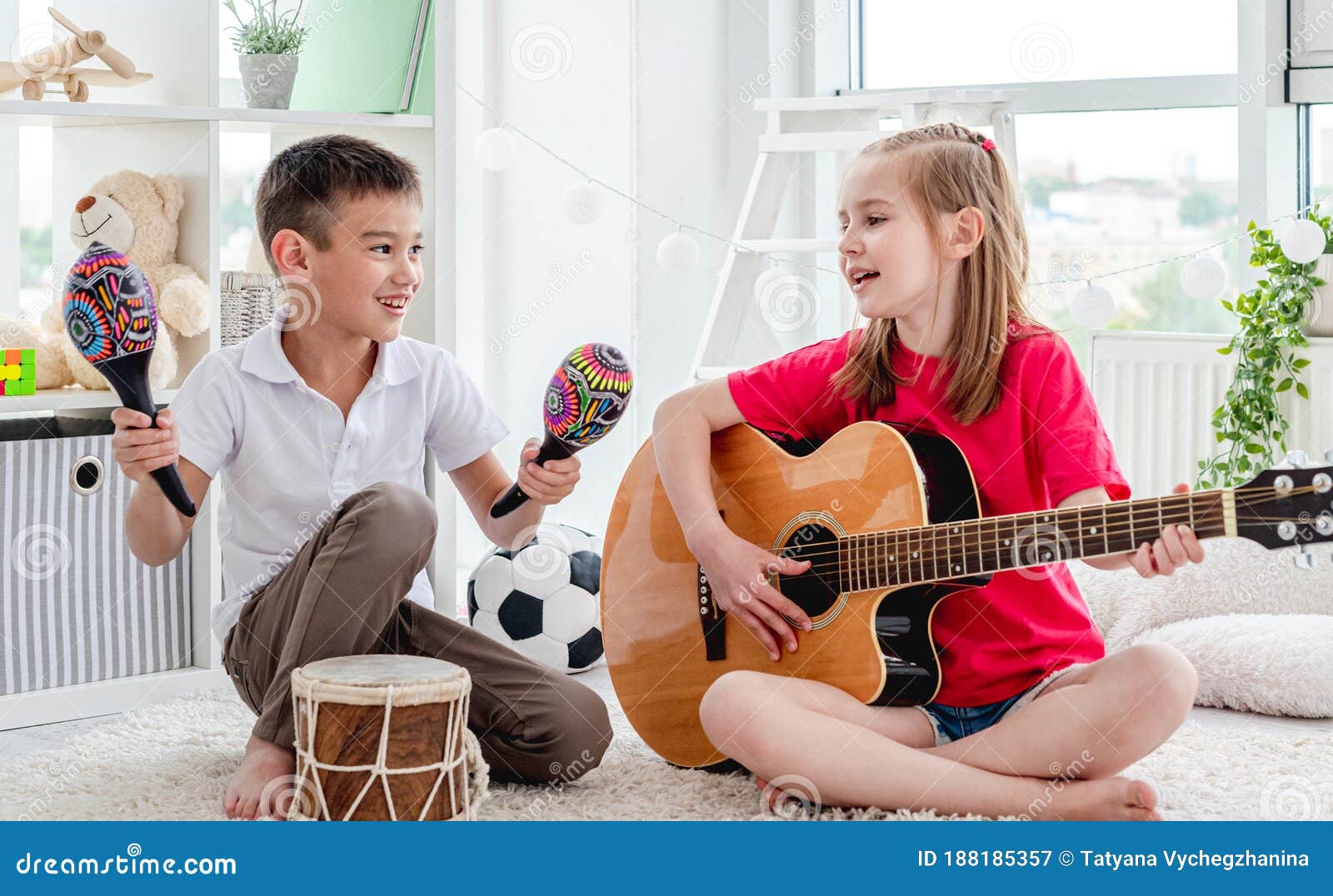 Smiling Kids Playing on Drum and Guitar Stock Image Image of home