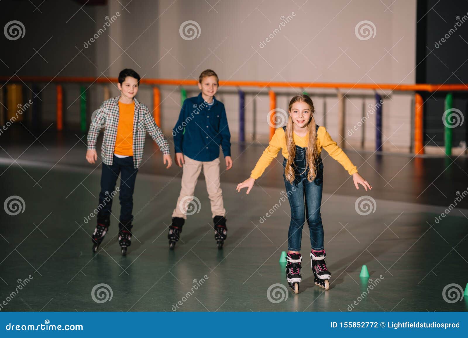 Smiling Kids in Roller Skates Training Stock Photo Image of