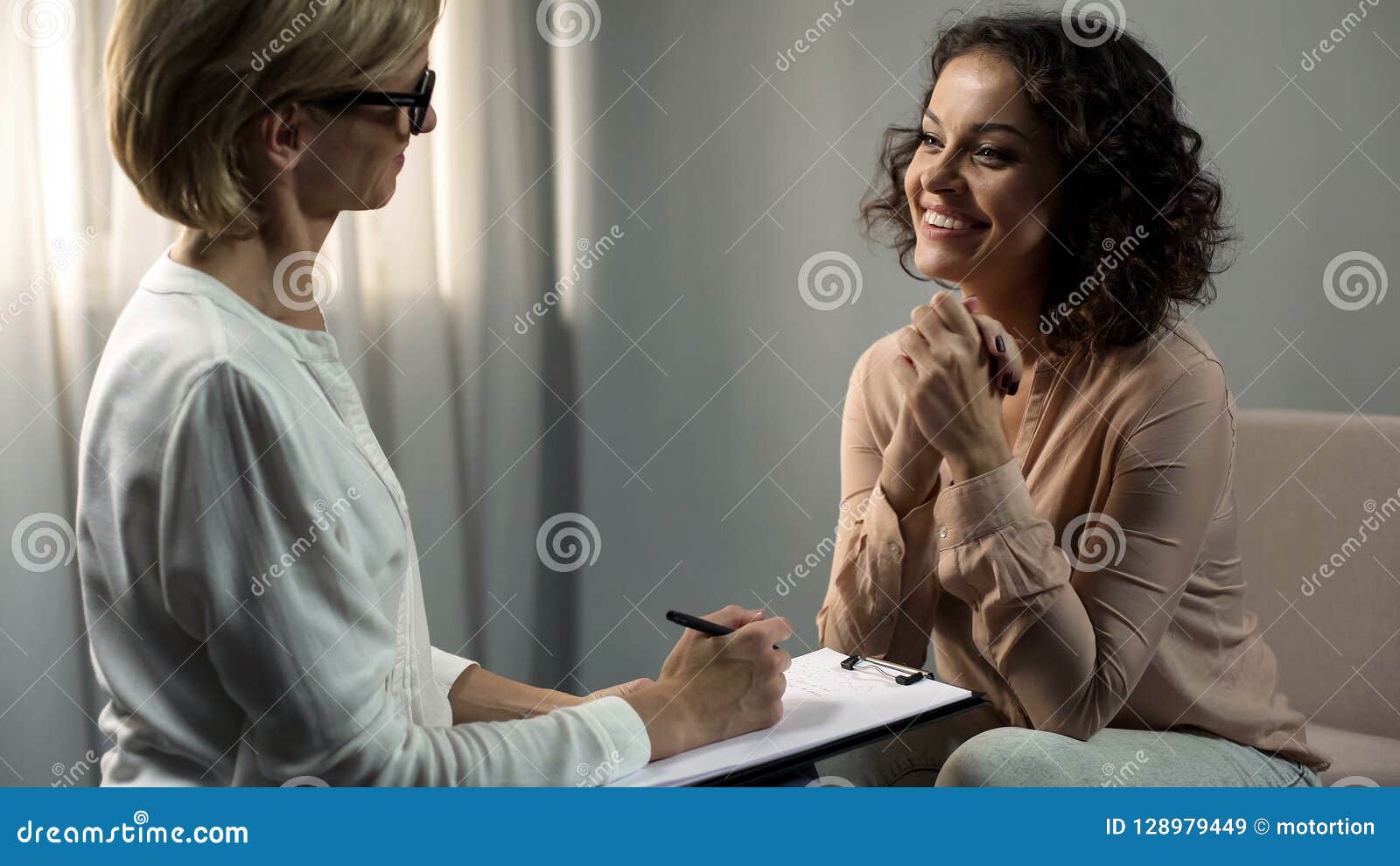smiling lady patient thanking her psychologist after depression rehab, therapy