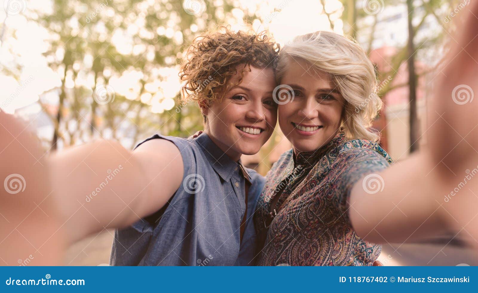 Smiling Lesbian Couple Standing Together In The City