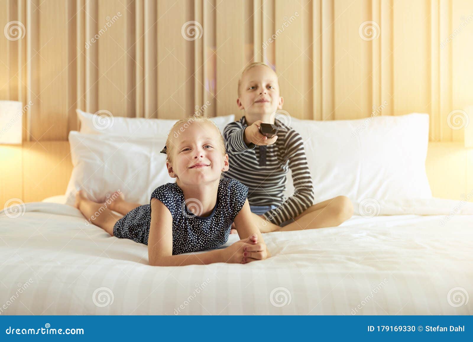 Young Sister On Parents Bed