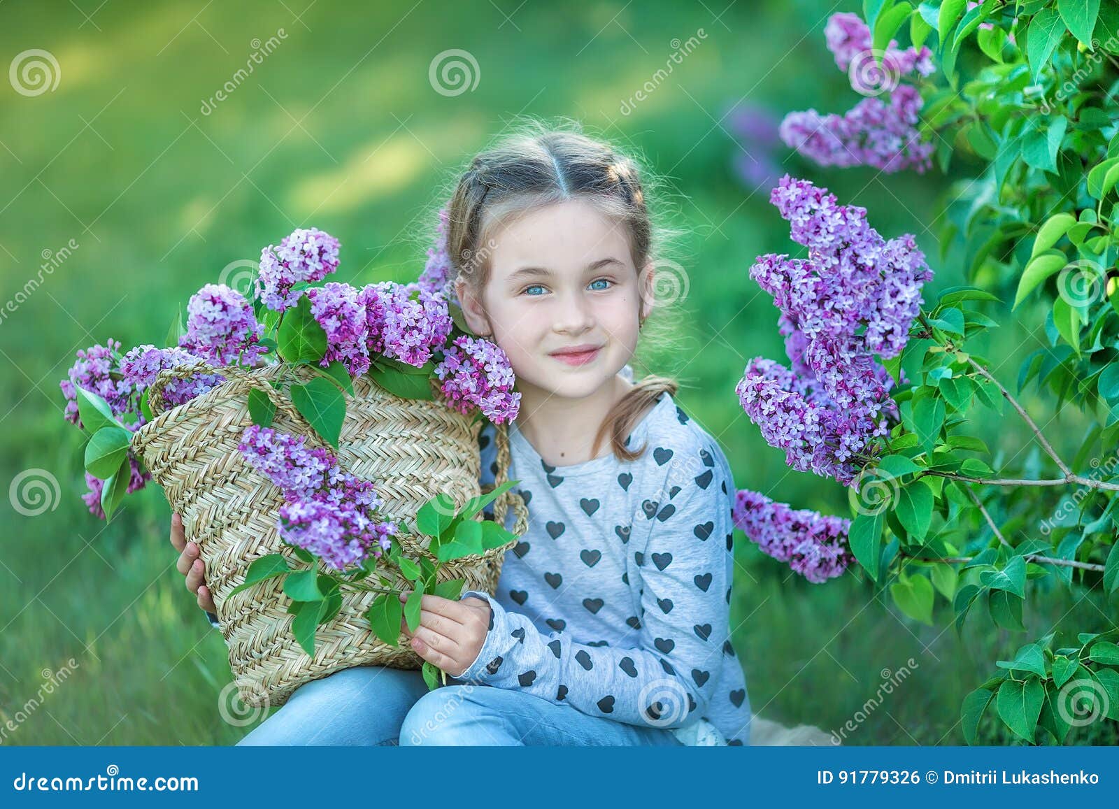 Smiling Little Cute Blonde Child Girl 4-9 Years with a Bouquet of Lilac ...