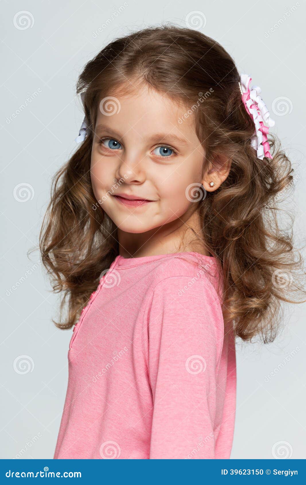 Smiling Little Girl Against the Gray Background Stock Photo - Image of ...