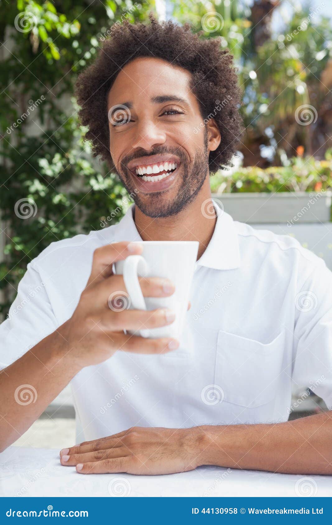 Smiling Man Having a Coffee Stock Photo Image of terrace, patio 44130958